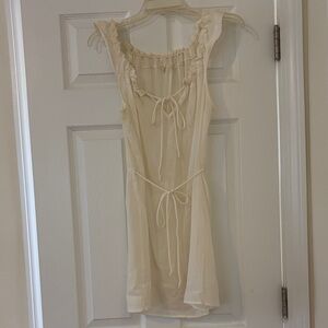 Sheer Cream Sleeveless Dress with Adjustable Ruffled Neckline